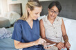 © aLListar/peopleimages.com - Happy woman, nurse and phone in elderly care for consultation, support or healthcare diagnosis at home. Female person, caregiver or medical professional on mobile smartphone to help senior patient