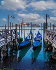 Wall Mural - Gondolas are the symbol of Venice and the San Giorgio Maggiore church in the back
