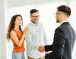 © Lumos sp - couple house property agent home real estate business buying investment apartment agreement deal client buyer new loan handshake shaking meeting agreement hand signing contract