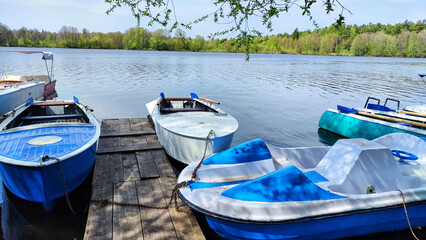 Wall Mural - Old boats on water of river or lake in autumn, sprin, summer season. Landscape with water and boat