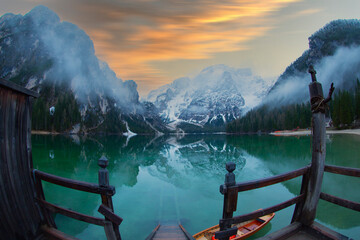 Wall Mural - Lake Braies (Lago di Braies) in Dolomites Mountains, Boat hut on Braies Lake with Seekofel mount on background, Sunrise of Italian Alps, Naturepark Fanes-Sennes-Prags, Dolomite, Italy, Europe.