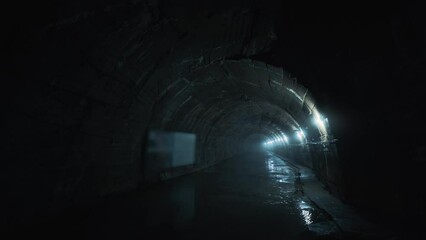 Wall Mural - Long concrete underground industrial tunnel or corridor.