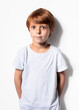 © Margarita Borodina - Red-haired boy in white t-shirt close-up cropped view at gray background