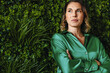 © Jacob Lund - CEO of a responsible business: Executive woman standing in a green office