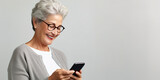 Fototapeta Uliczki - illustration of a happy, smiling, mature fashionable Caucasian woman using a smartphone - on light gray background with copy space