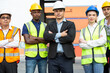 © winnievinzence - Group of team logistic worker and manager standing in arms crossed at container warehouse. Confidence and successful teamwork, corporate business of industrial factory. vision and mindset concept