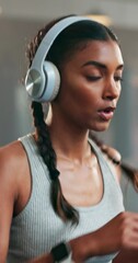 Poster - Fitness, headphone and a woman with a watch at gym for running, progress and time. Indian athlete person listening to music, podcast or audio on health app for exercise motivation, focus and wellness