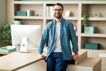 Aufkleber - Portrait Of Handsome Young Businessman Standing Near Desk In Office Interior