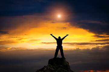 Man standing on top of a mountain.