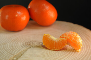 Wall Mural - fresh tangerines on a wooden table