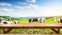 Empty Wooden Table Top With Blur Green Meadow, Cows On A Grass Field During The Summer, Morning Light Background. For Display Or Montage Your Products, Digital Ai