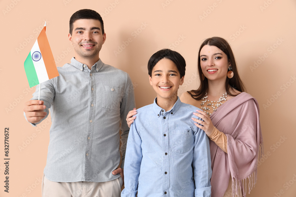 Happy family with Indian flag on beige background