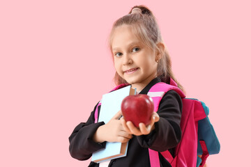 Sticker - Little schoolgirl with book and apple on pink background