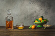 © The Picture Pantry - Bourbon in vintage decanter and rocks glass with bowl of mandarin oranges ond bowl of pistachios