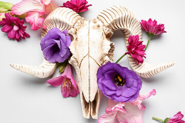 Wall Mural - Composition with skull of sheep and beautiful flowers on white background