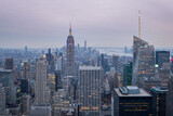 Fototapeta  - Panoramic view of the Manhattan skyline at sunset, with the Empire State Building in the foreground