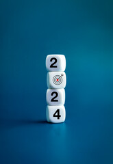 Poster - 2024 Happy New year background banner. Numbers and target dart icon on white blocks stacked on blue background, vertical style. Welcome, Merry Christmas, and Happy New Year in 2024.