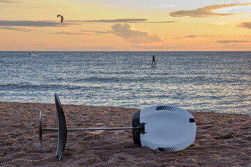 Wall Mural - Kite surfing on hydrofoil. hydrofoil sand. Selective focus.