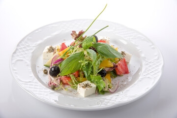 summer vegetable salad laid out on a plate