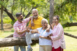 © PRASANNAPIX - Indian family giving happy expression at park.