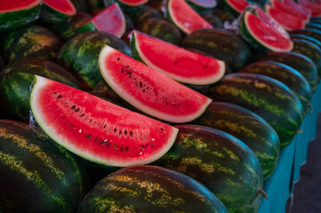 Wall Mural - Fresh watermelons sale in the traditional farm Turkish market, a counter filled with fresh fruits