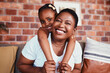 © Ramba/peopleimages.com - Portrait of mom and kid on sofa with hug, bonding and relax in living room together. Love, mother and daughter on couch in apartment with embrace, support and trust for black woman with girl child.