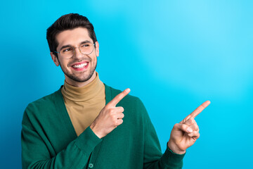 Poster - Portrait of successful positive ceo man beaming smile look direct fingers empty space isolated on blue color background