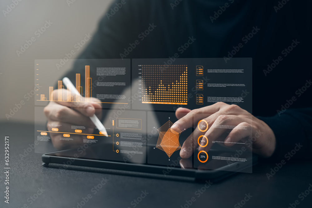 Businessman using tablet analyzing business growth graph data and ...
