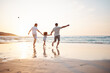 © Davids C/peopleimages.com - Gay couple on beach, men and child, playing together and holding hands at sunset, running in waves on holiday. Love, happiness and sun, lgbt family on tropical ocean vacation and fun with daughter.