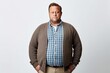© Leon Waltz - Group portrait photography of a man in his 40s expressing concern about his weight due to obesity wearing a chic cardigan against a white background