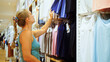 Happy woman looking at clothing in shopping center clothing store mall. Female shopper enjoying purchase in branded fashion boutique in shopping center. Shopper looking at clothing indoors in store