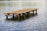 Fototapeta Pomosty - 
Wooden boardwalk on the water