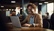 © terra.incognita - Smiling business man businessman sitting in a restaurant working on a laptop.