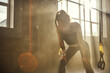 © Friends Stock - Time to rest. Young athletic woman in sportswear looking exhausted while standing in front of windows at gym.