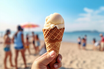 Aufkleber -  a person holding a vanilla gelato ice cream cone in his hand on a beach. family and friends people blurred in the background.  Generative AI technology.