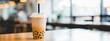 Bubble tea with milk and tapioca at a coffee shop created with Generative AI.