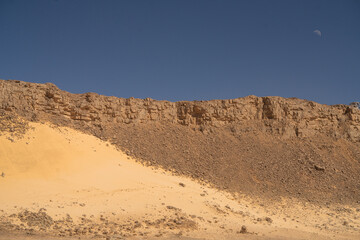 Wall Mural - view in the Sahara desert of Tadrart rouge tassili najer in Djanet City  ,Algeria.colorful orange sand, rocky mountains