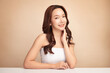 © kitthanes - Beautiful young asian woman with clean fresh skin on beige background, Face care, Facial treatment, Cosmetology, beauty and spa, Asian women portrait.