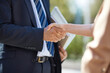 © Connect Images - Hands of businessman and businesswoman shaking hands