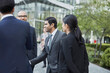 © Connect Images - Businesspeople greeting each other at business park