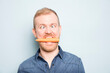 © Connect Images - Young man eating carrot