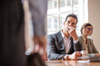 © Connect Images - Businesspeople listening during meeting in conference room