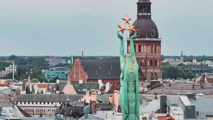 Wall Mural - Beautiful aerial view of Riga city - the capital of Latvia. Statue of liberty Milda - the symbol of freedom of Latvia.