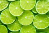 Fototapeta Panele - Slices of fresh lime as a background,top view.