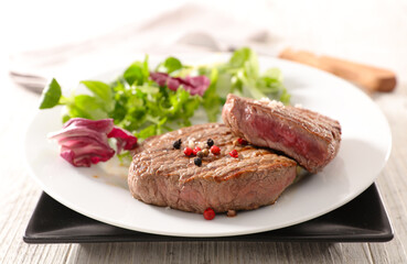 Wall Mural - grilled beef steaks with salad