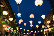 Low Angle View Of Lanterns Over Street