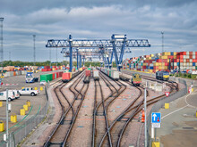 Dockyard Railway Tracks And Cargo Cranes, Felixstowe, England.