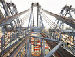 © Connect Images - View across cargo crane in dockyard with shipping containers below, Felixstowe, England
