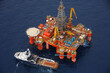 © Connect Images - Aerial view of oil rig and ship on sea