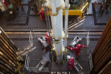 View From Above Of Workers At Oil Rig